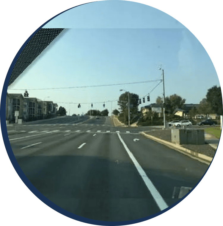 A view of the street from inside a car.