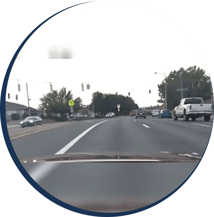 A view of the windshield from inside a car.